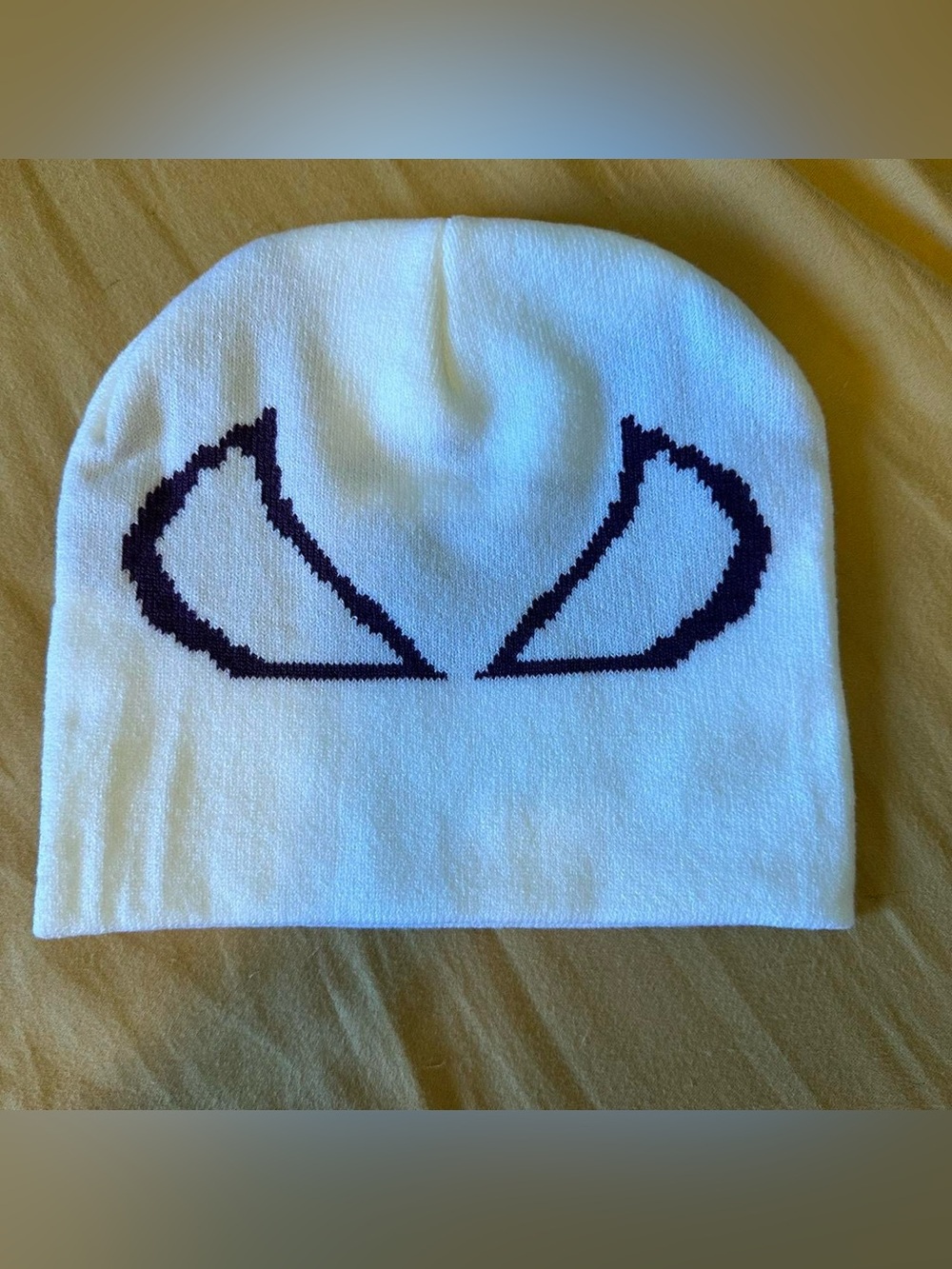 White and purple spiderman beanie.